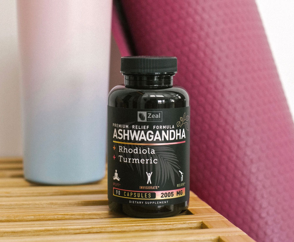 Bottle of Ashwagandha next to water bottle on a bench