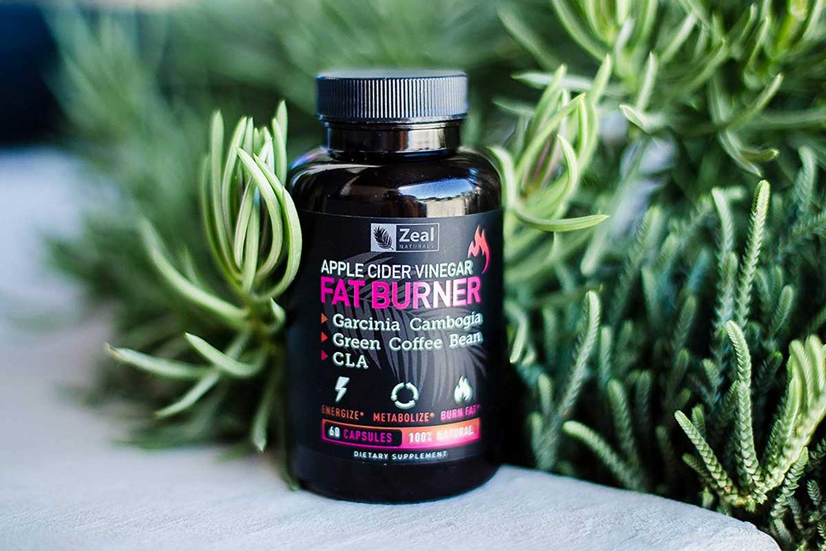 Apple Cider Fat burner bottle next to a plant